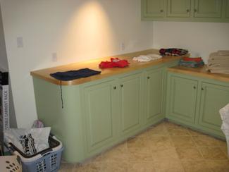 Laundry Room with Custom Cabinetry and Maple Counter Tops