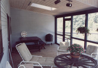 Screened-in porch with Glass Ceiling - (Interior View: wood ceiling and skylights)