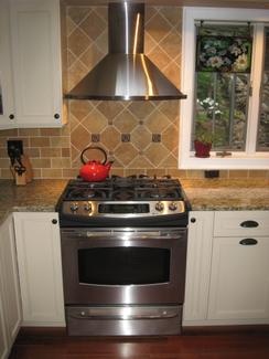 Kitchen EE- Remodel with Beam Installation (Detail: Oven with industrial hood and Tiled Backsplash/Wall)