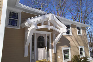Timberframe front Entrance & Hardy Siding & Deck -After - Detail View